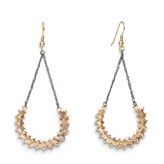 Trebor Style handmade snake vertebrae earrings with vintage chain and brass French hooks on a white background.