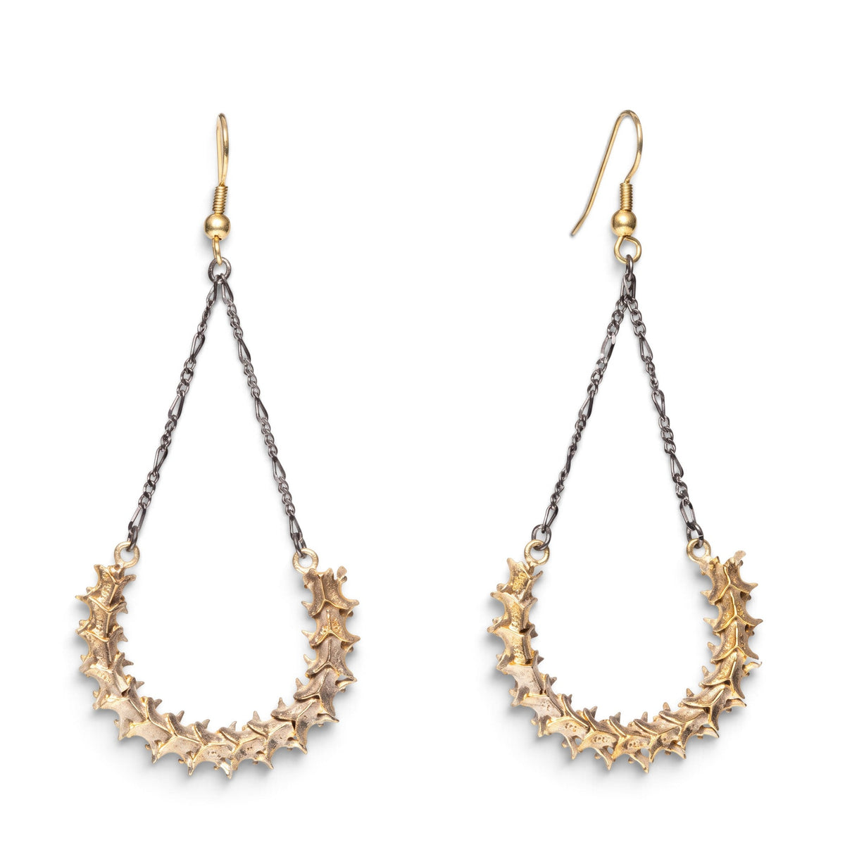 Trebor Style handmade snake vertebrae earrings with vintage chain and brass French hooks on a white background.