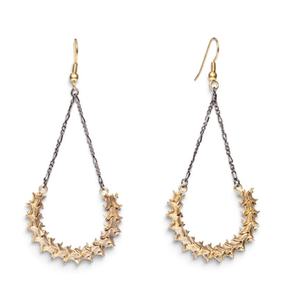 Trebor Style handmade snake vertebrae earrings with vintage chain and brass French hooks on a white background.