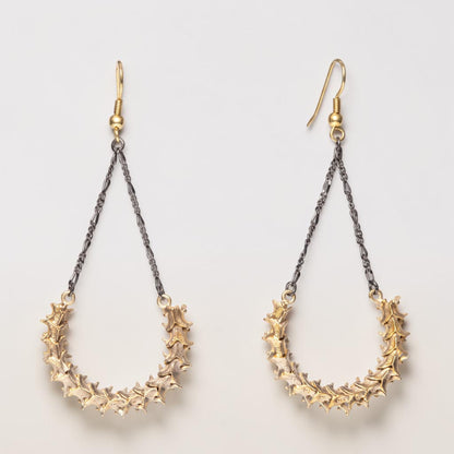 Trebor Style earrings featuring real snake vertebrae suspended from vintage chains with brass French hooks