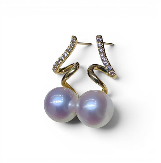 Trebor Style 14k gold spiral earrings featuring lustrous 8mm Edison pearls and sparkling zircon accents.