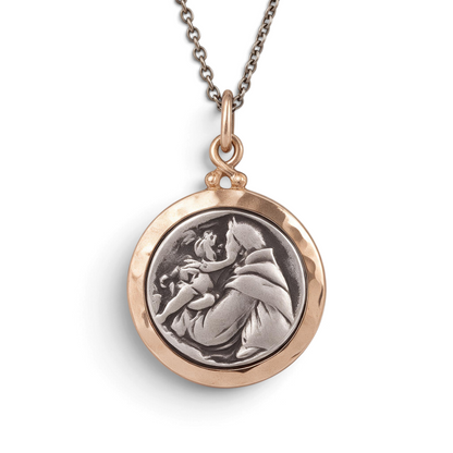 Trebor Style St. Anthony of Padua pendant in sterling silver with a 14k gold frame on a silver cable chain.
