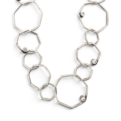 Trebor Style sterling silver geometric chain necklace with etched open links and bezel-set white cubic zirconia stones.