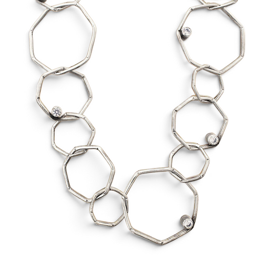 Trebor Style sterling silver geometric chain necklace with etched open links and bezel-set white cubic zirconia stones.