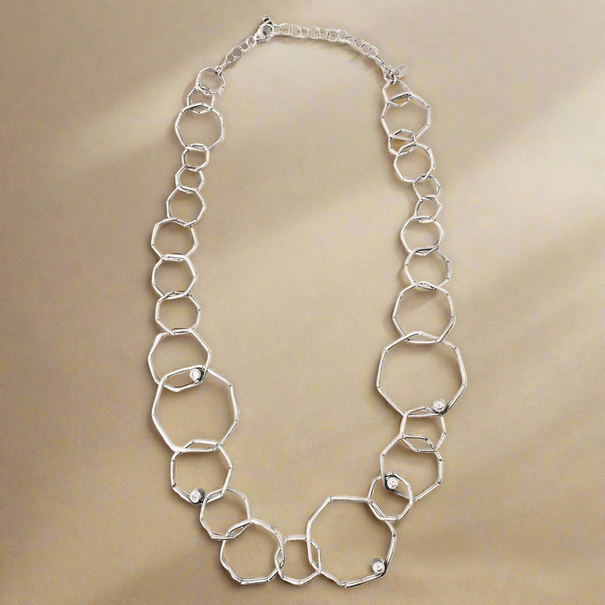 Trebor Style sterling silver geometric chain necklace with textured open links and sparkling cubic zirconia accents.