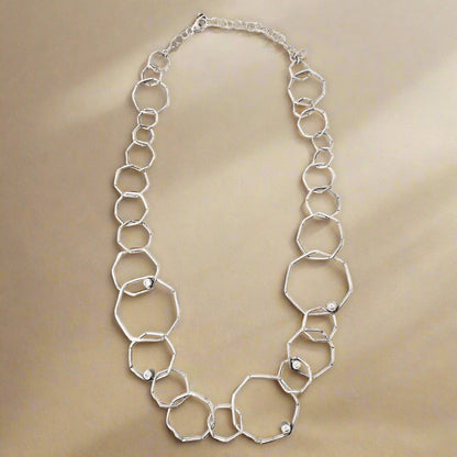 Trebor Style sterling silver geometric chain necklace with textured open links and sparkling cubic zirconia accents.