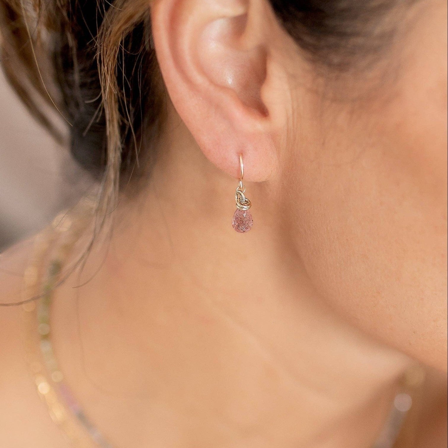Trebor Style petite faceted strawberry quartz briolette drop earrings with gold-filled hooks worn on an ear