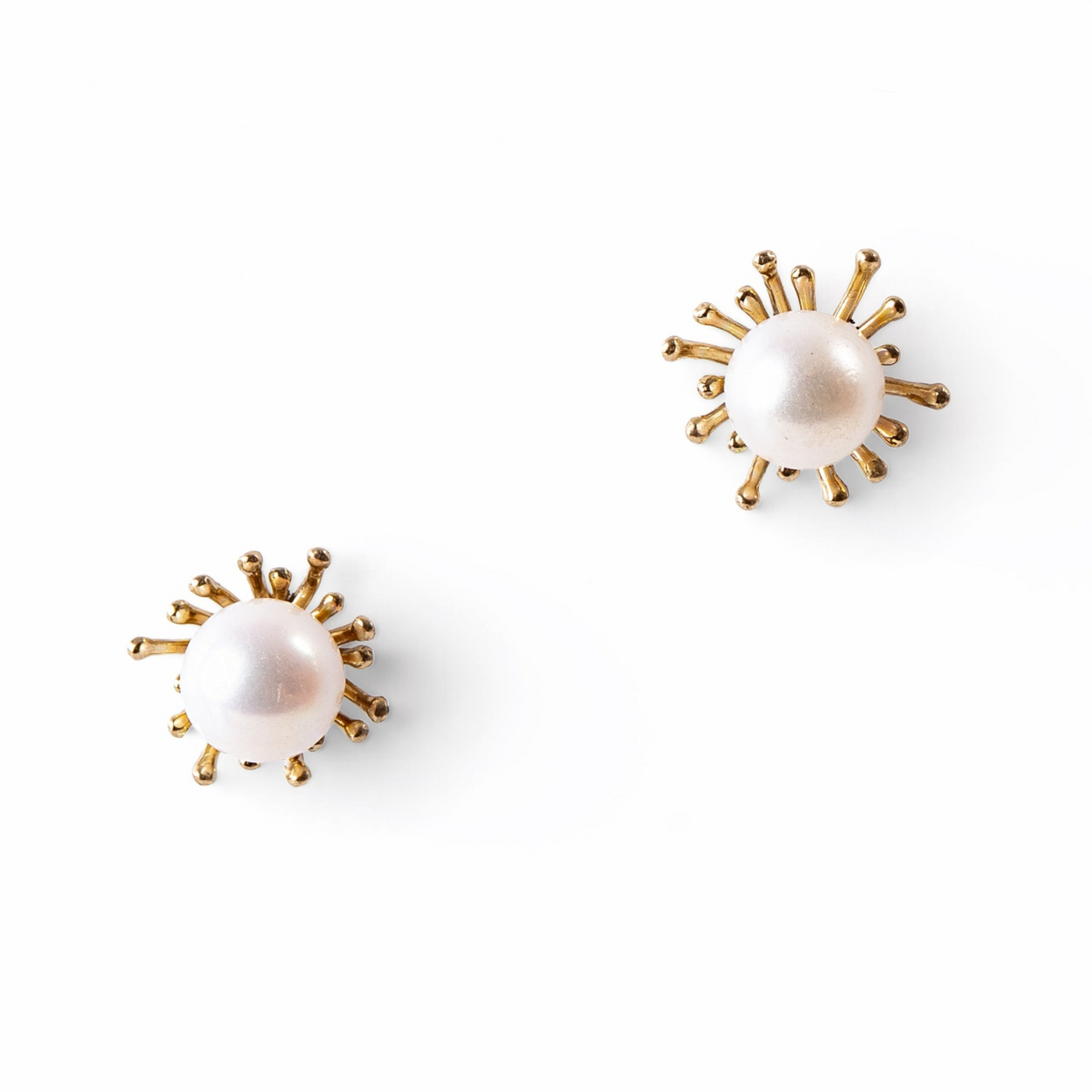 Trebor Style sunburst stud earrings featuring white Japanese Akoya cultured pearls set in 14k yellow gold.