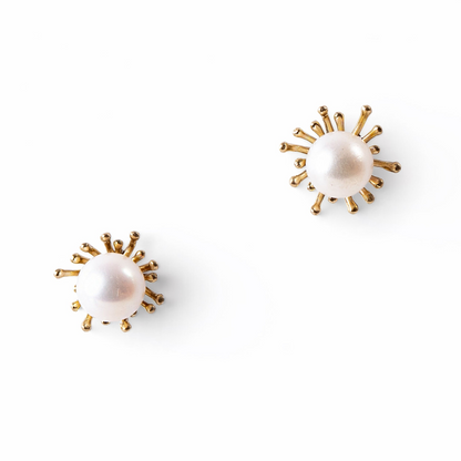 Trebor Style sunburst stud earrings featuring white Japanese Akoya cultured pearls set in 14k yellow gold.