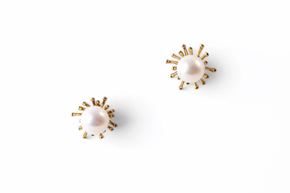 Trebor Style sunburst stud earrings featuring 8.5-9mm white Japanese Akoya cultured pearls set in 14k yellow gold.