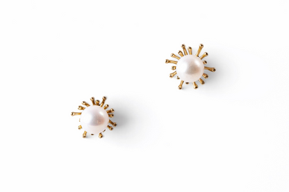 Trebor Style sunburst stud earrings featuring 8.5-9mm white Japanese Akoya cultured pearls set in 14k yellow gold.