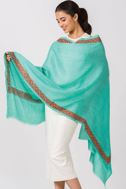 Trebor Style Taisha hand embroidered wool blend shawl in orchid with a floral peach, pink, and green border.