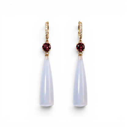 Trebor Style teardrop earrings featuring translucent blue chalcedony, deep red garnet accents, and gold-tone pavé crystals.