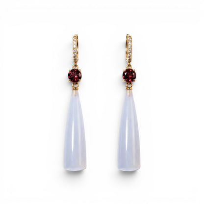 Trebor Style teardrop earrings featuring translucent blue chalcedony, deep red garnet accents, and gold-tone pavé crystals.