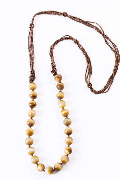 Trebor Style Rajola long necklace featuring large tiger eye beads and multi-strand copper hematite accents.