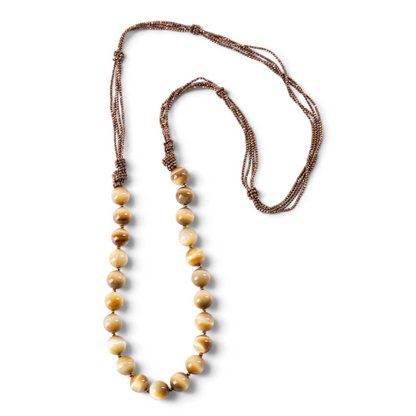 Trebor Style long Rajola necklace featuring large tiger eye beads and multi-strand copper hematite cord, made in Italy.