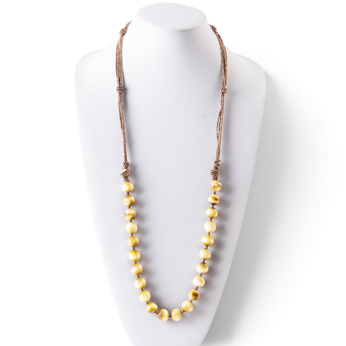 Trebor Style long Rajola necklace featuring large golden tiger eye beads and multi-strand copper hematite accents.