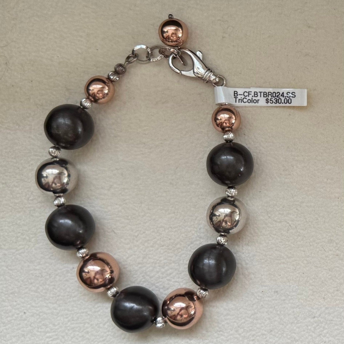 Trebor Style tri-color sterling silver bead bracelet with rhodium, oxidized, and rose gold plated finishes.