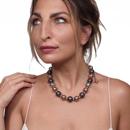 Trebor Style tri-color sterling silver bead necklace with rhodium, oxidized, and rose gold finishes on a model