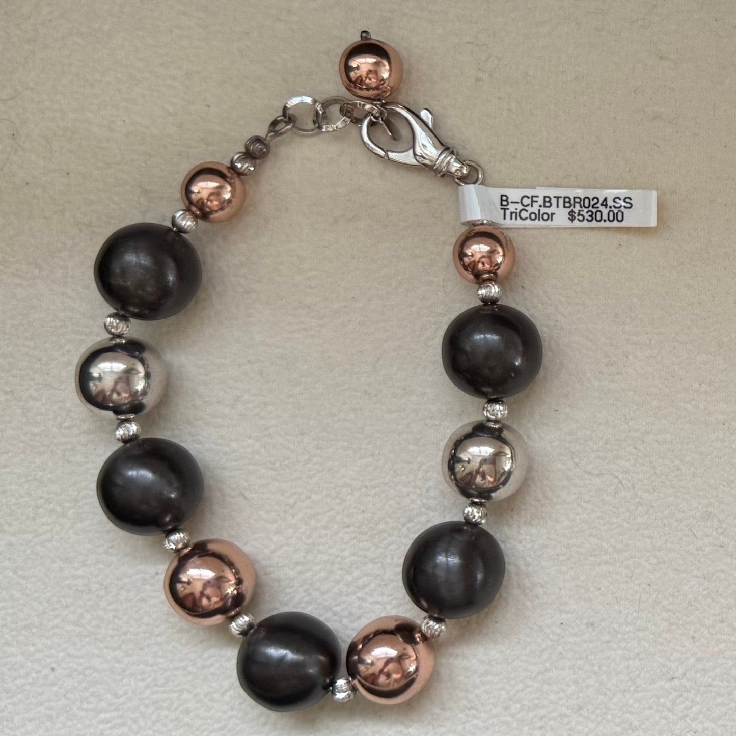 Trebor Style tri-color sterling silver bead bracelet with rhodium, oxidized, and rose gold plated beads.
