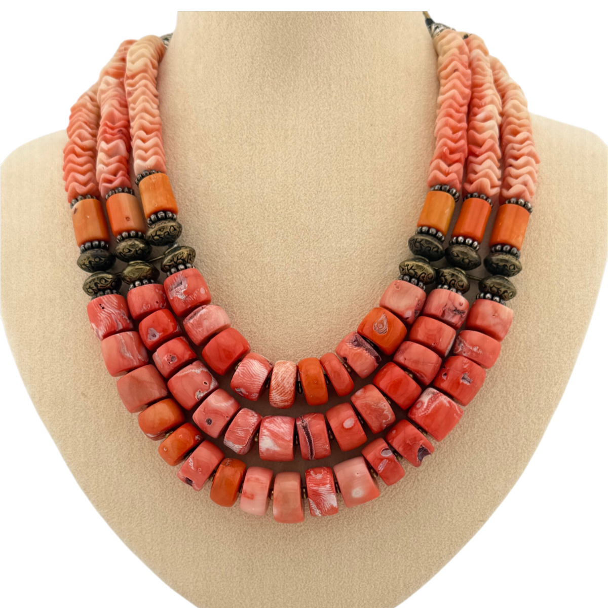 Trebor Style Masha Archer triple strand necklace featuring orange stained coral rondelles, pewter beads, and floral motifs