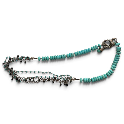 Trebor Style asymmetrical necklace featuring turquoise, amazonite, and spinel beads with sterling silver chain strands.