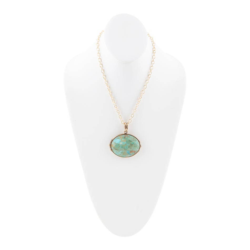 Trebor Style handcrafted necklace featuring a genuine turquoise pendant on a long golden bronze chain.