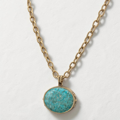 Trebor Style turquoise pendant necklace with a golden bronze chain and silver plated details in a Southwest style.