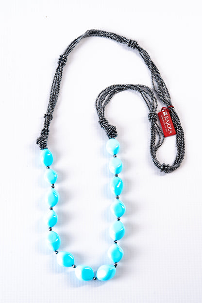Trebor Style long necklace featuring large turquoise faux beads and multi-strand gray hematite accents, made in Italy.