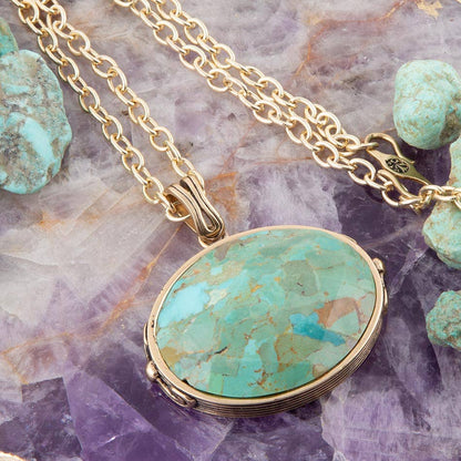 Trebor Style handcrafted oval turquoise pendant necklace with a golden bronze and silver-plated chain.