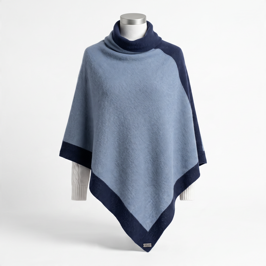 Trebor Style two-tone heather blue and navy cashmere blend poncho with a cowl neck and elegant draped fit.