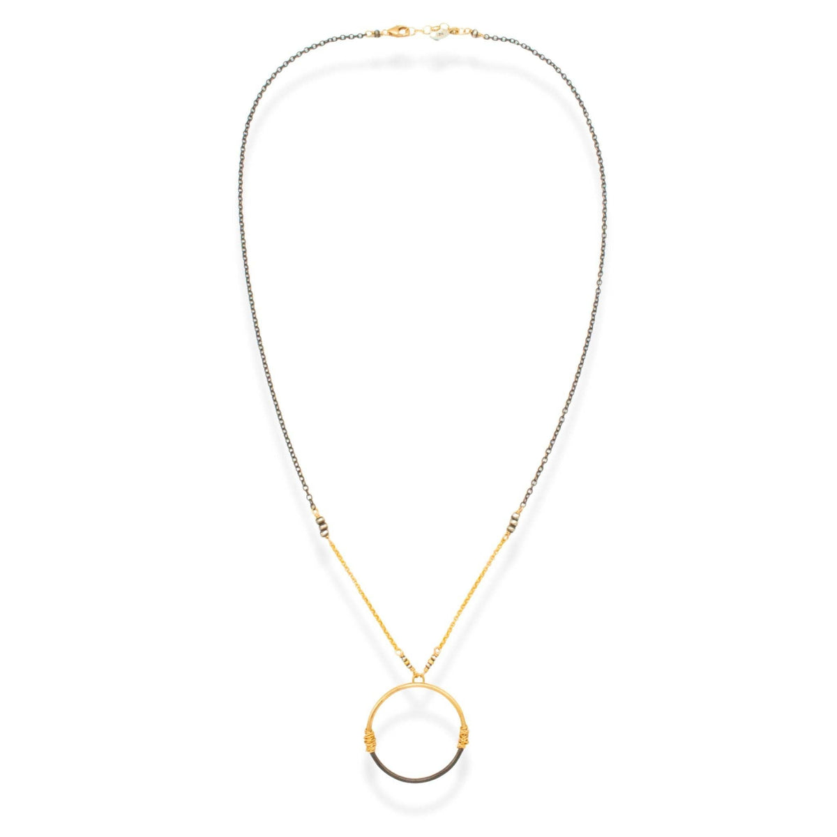Trebor Style two-tone circle pendant necklace featuring 14K gold-filled and oxidized sterling silver wire wrapping.