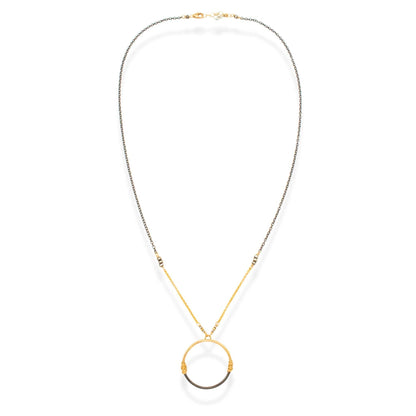 Trebor Style two-tone circle pendant necklace featuring 14K gold-filled and oxidized sterling silver wire wrapping.