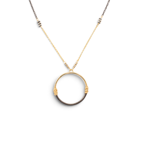 Trebor Style two-tone circle pendant necklace featuring wire-wrapped 14K gold-filled and oxidized sterling silver.