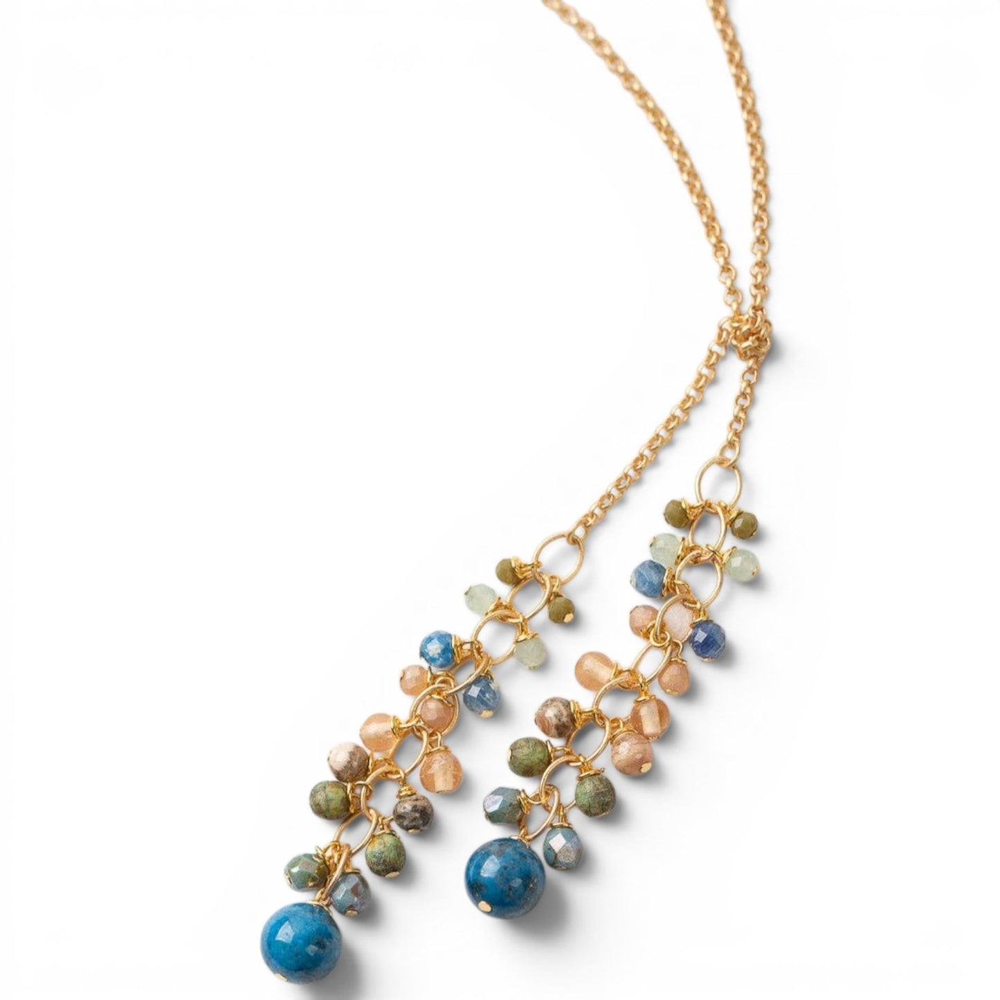 Trebor Style waterfall lariat necklace featuring blue kyanite, crystal, and Czech glass beads on a matte gold chain.