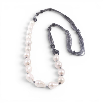 Trebor Style long necklace featuring large white baroque pearls and multi-strand hematite accents, made in Italy.