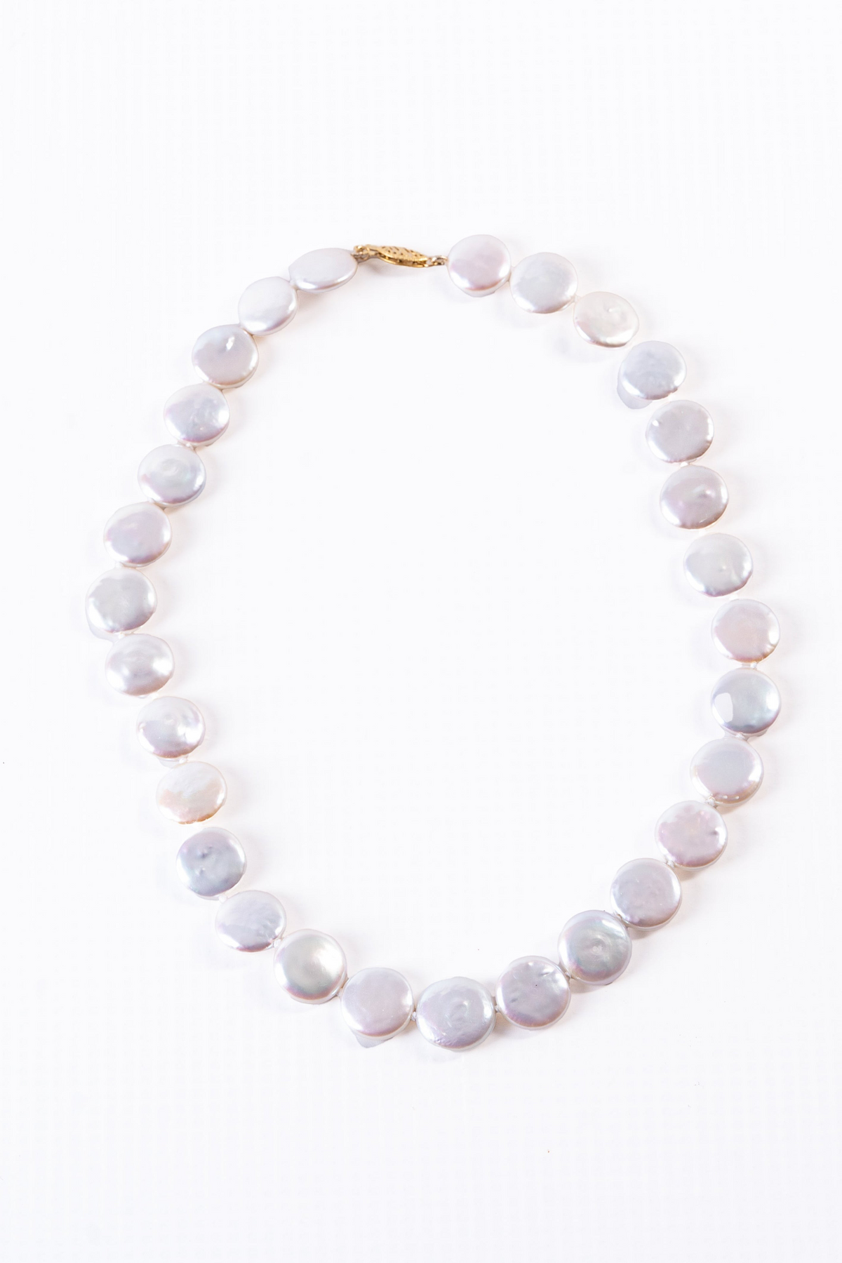 Trebor Style white freshwater coin pearl necklace with a 14k gold latch clasp on a white background.