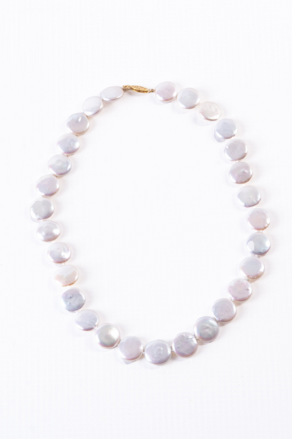 Trebor Style white freshwater coin pearl necklace with a 14k gold latch clasp on a white background.