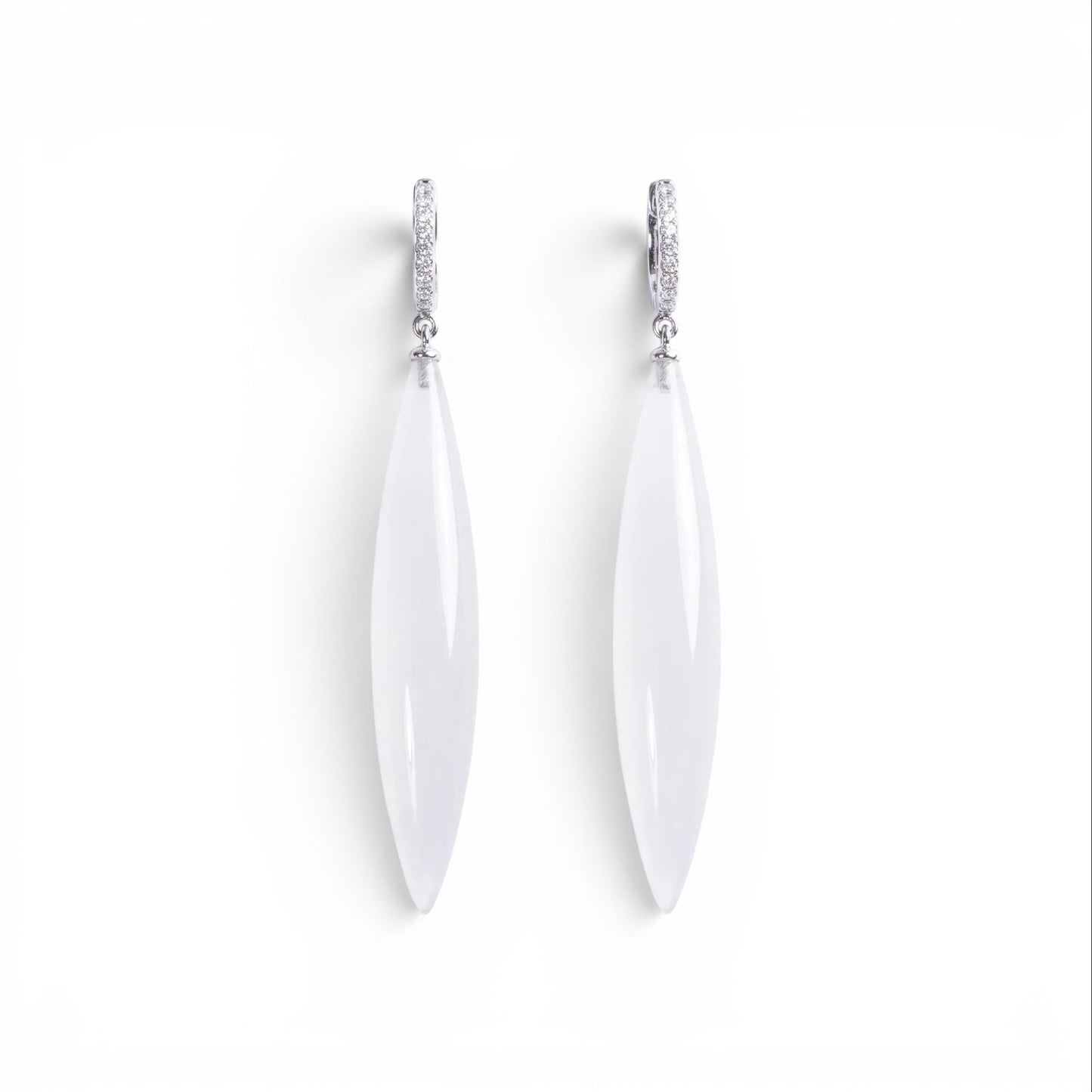Trebor Style long drop earrings featuring translucent white marquise pendants on silver pavé crystal hoops.