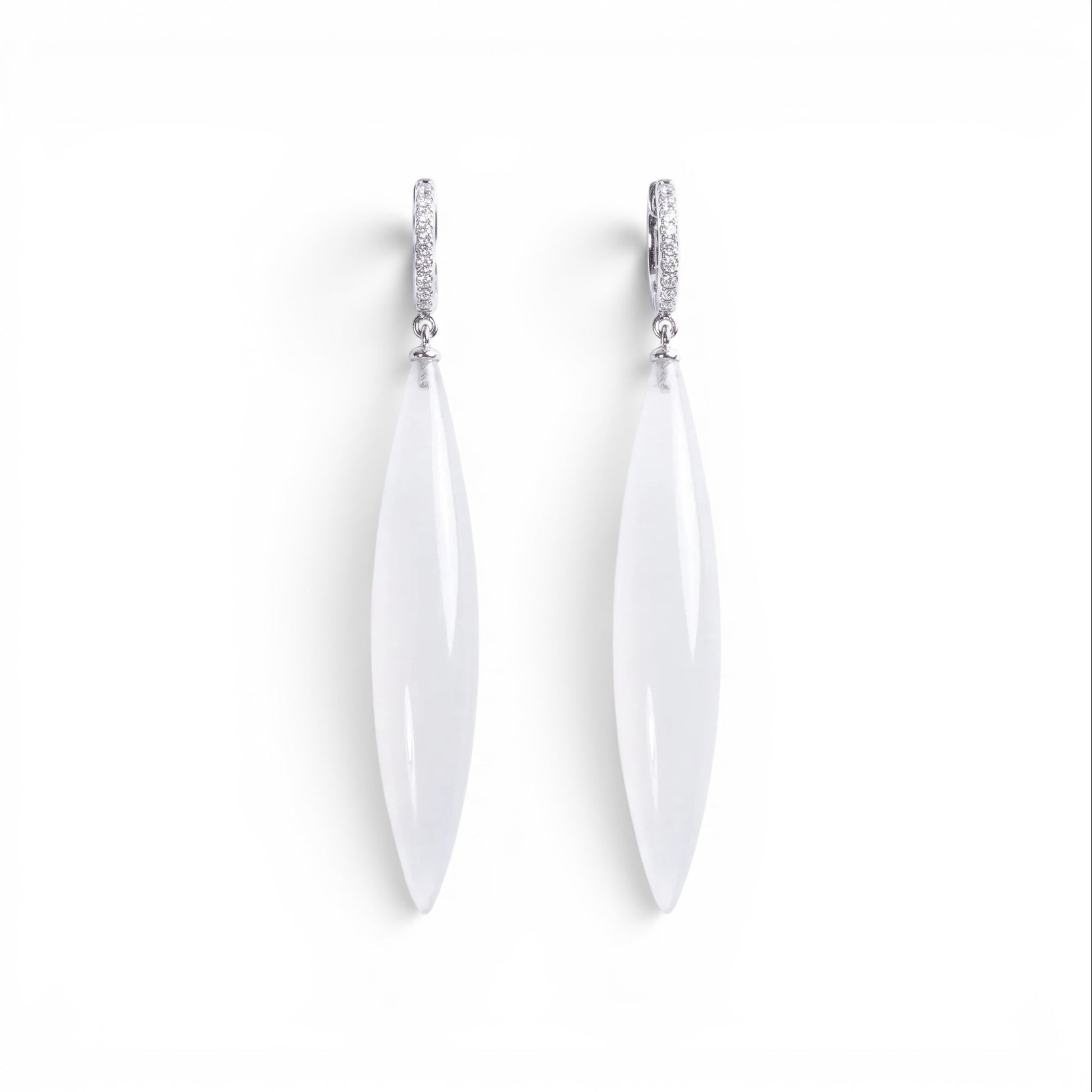 Trebor Style long drop earrings featuring translucent white marquise pendants on silver pavé crystal hoops.