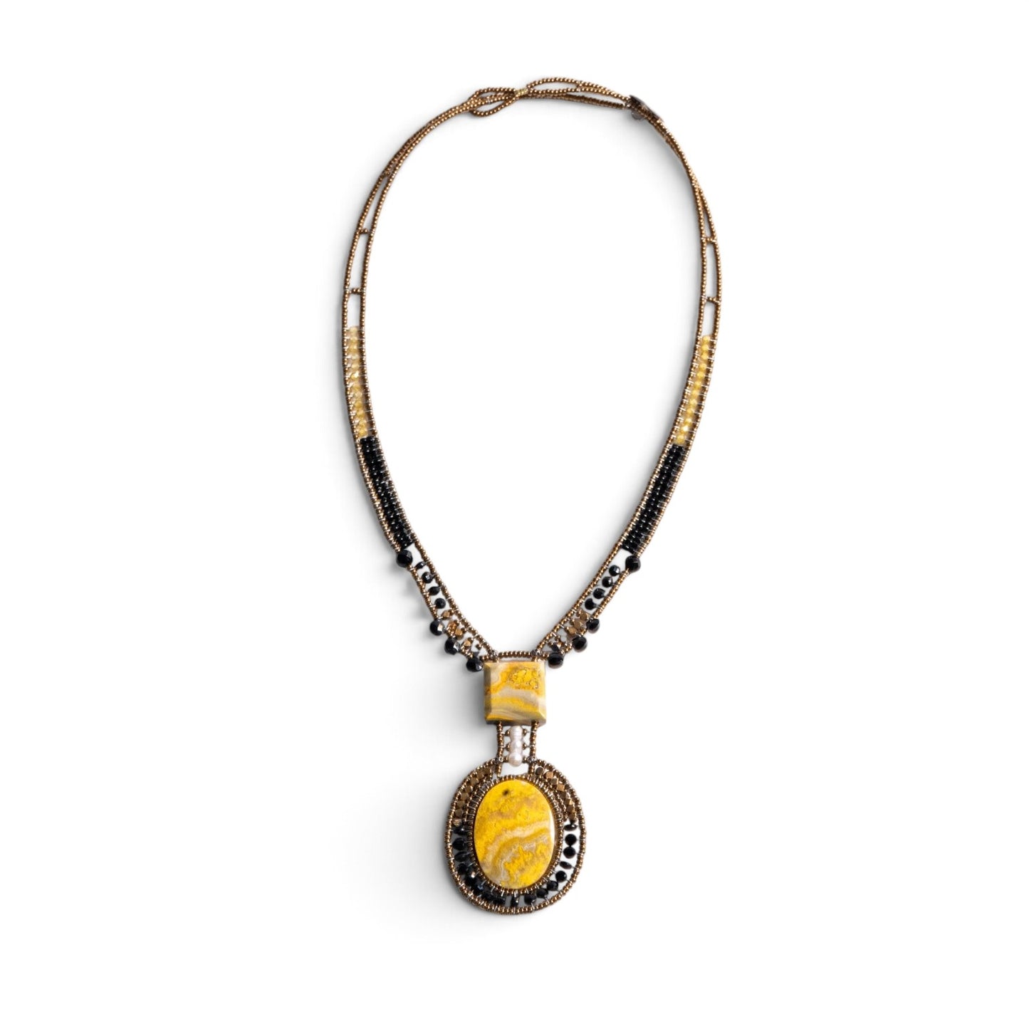 Trebor Style artisan statement necklace featuring yellow jasper stones, bronze, gold, and black beads with a pearl.