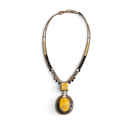 Trebor Style artisan statement necklace featuring yellow jasper stones, bronze, gold, and black beads with a pearl.