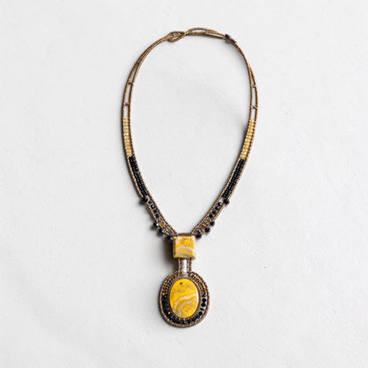 Trebor Style artisan statement necklace featuring yellow jasper, black glass beads, and a white pearl pendant.