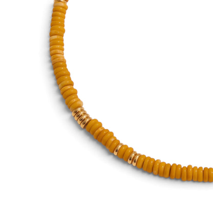 Trebor Style yellow jasper heishi bead necklace with gold-plated accents on a white background