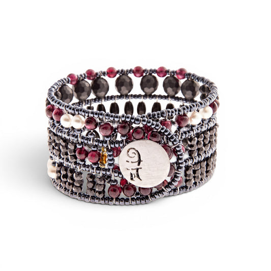 Trebor Style Ziio Aki cuff bracelet featuring black onyx, garnet, and pearl beads with a sterling silver button closure.