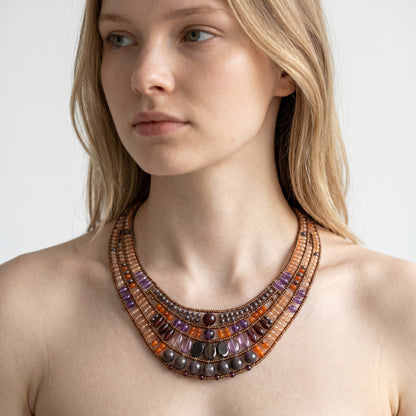 Trebor Style Ziio Aki bib necklace featuring carnelian, amethyst, garnet, and Murano glass beads on a model.