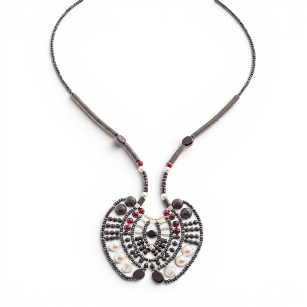 Trebor Style Ziio Aki statement necklace with black onyx, garnet, and pearl beads on a stainless steel wire frame.