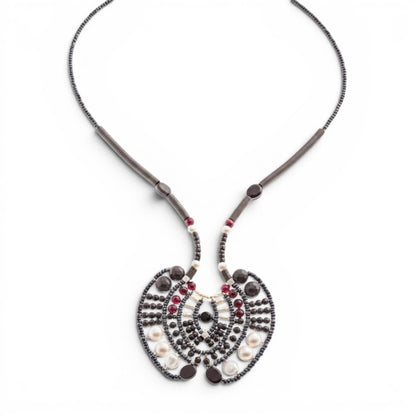 Trebor Style Ziio Aki statement necklace with black onyx, garnet, and pearl beads on a stainless steel wire frame.