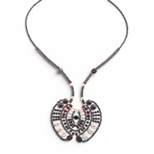 Trebor Style Ziio Aki statement necklace with black onyx, garnet, and pearl beads on a stainless steel wire frame.