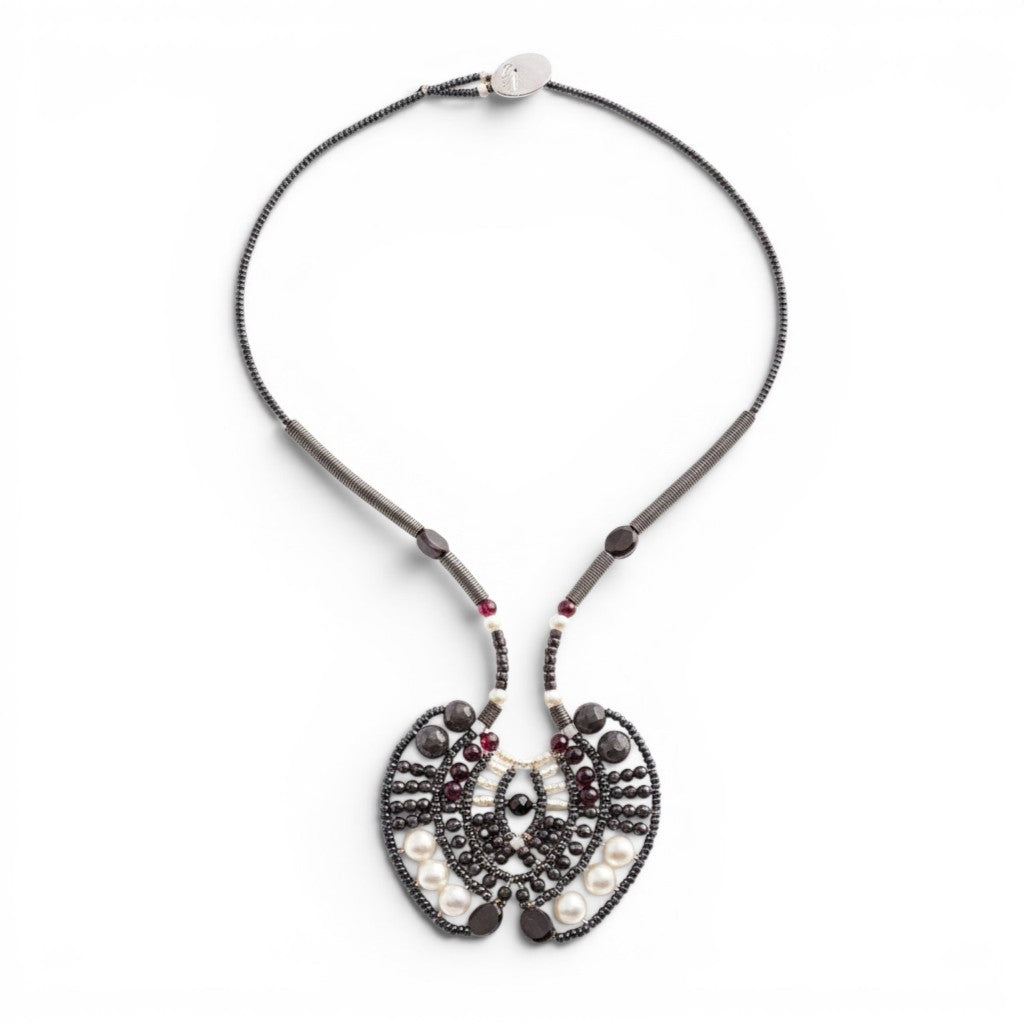 Trebor Style Ziio Aki statement necklace featuring black onyx, garnet, and white pearl beads on stainless steel wire.
